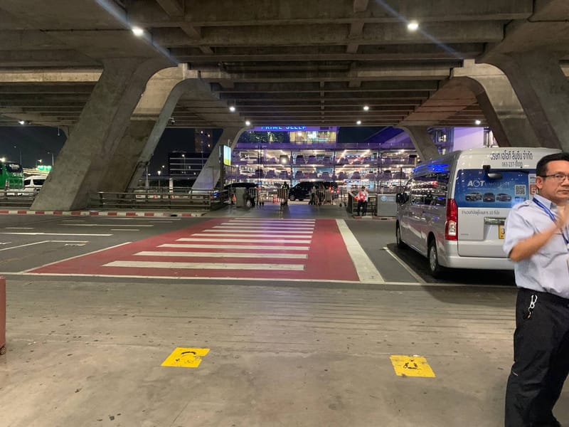 Zebra crossing from arrival hall to inner pickup curb